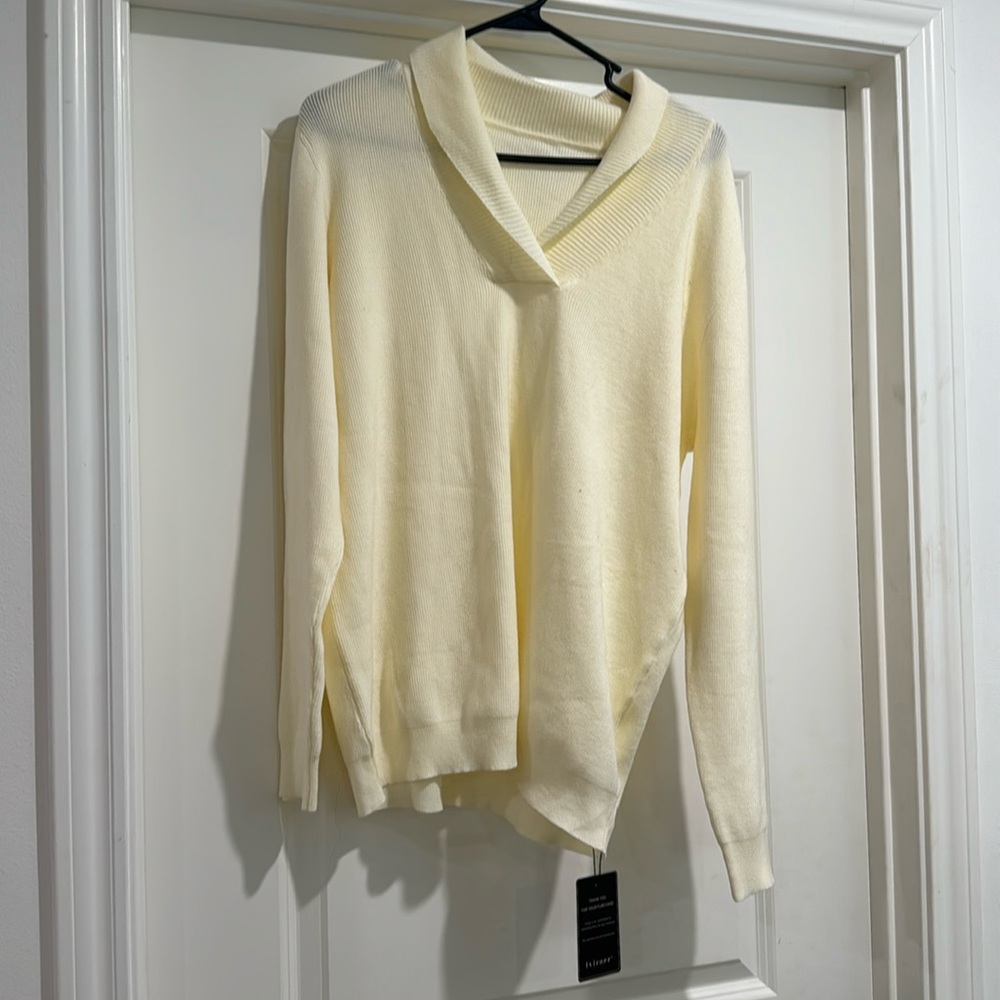 Women’s NWOT cream colored sweater. Light weight and very soft.